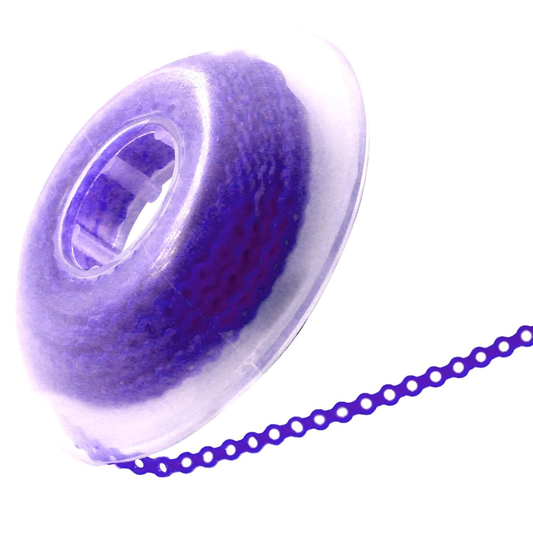 Close-up of a spool of purple thread with a chain on a white background