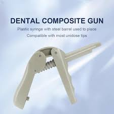 Plastic composite gun used for dispensing unidose composite compules during restorative procedures