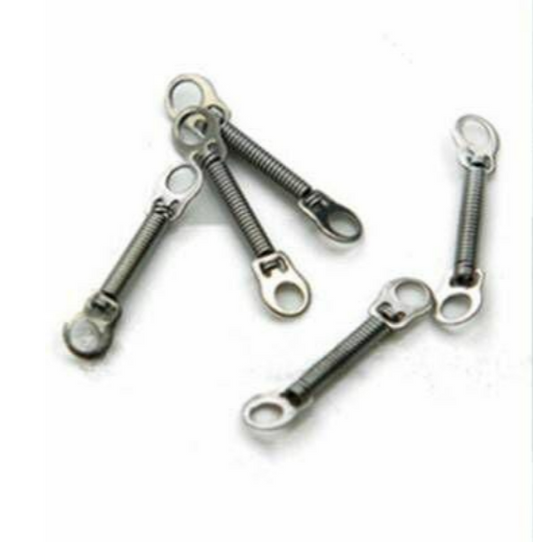 Metal spring-loaded toggle bolts on a white background