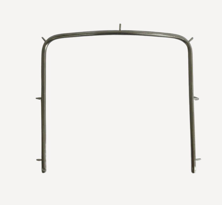 Stainless steel U-shaped rubber dam frame with peripheral retaining pins for dental dam sheet retention during isolation procedures.