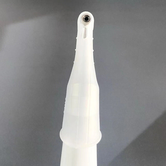 White dental tool on a gray background