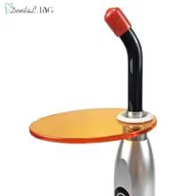 Orange dental light curing filter shield for blue light eye protection during composite and bonding agent photopolymerisation procedures.