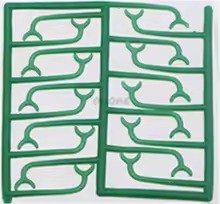 Pattern of green whale shapes on a white background