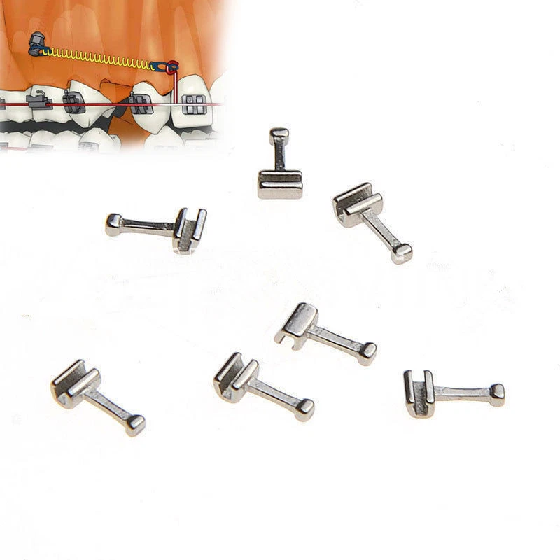 Metal dental brackets on a white background with an inset showing a dental model.