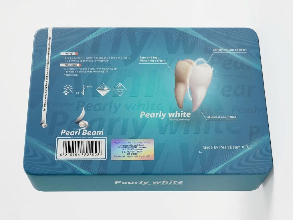 A rectangular blue product box for Pearl Beam teeth whitening, featuring a graphic of a white tooth, text reading 'Pearly white,' a barcode, and product details on a white background.Pearly White Light Activating Gel kit by Dermabrite, featuring the blue and white retail box above an open black foam tray holding three syringes and a green applicator tip, on a plain white background.
Pearly White professional in-office dental tooth bleaching kit 