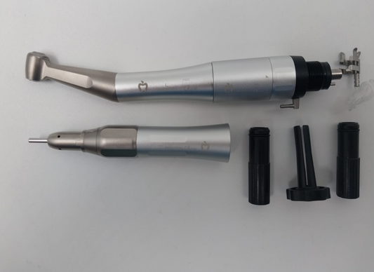 Dental tool with attachments on a light gray background