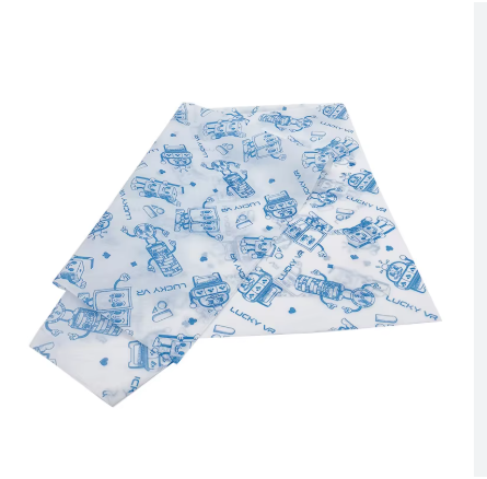 Pack of waterproof colored dental bibs and piercing clean pads with plastic backing.