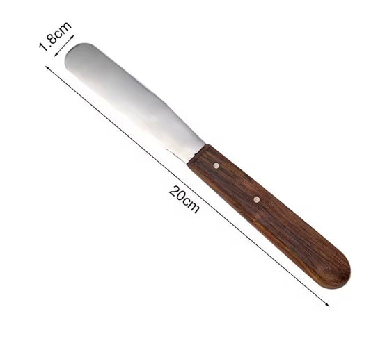Stainless steel dental mixing spatula with wooden handle, 20 cm length, used for mixing alginate and dental plaster.