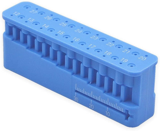 Endodontic file measuring block with integrated millimeter ruler and file slots for chairside organisation during root canal treatment.