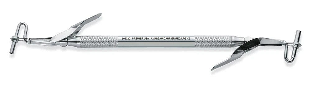 Pakistan double end stainless steel amalgam carrier with regular and large tips and spring-loaded plunger for amalgam placement in restorative dentistry.