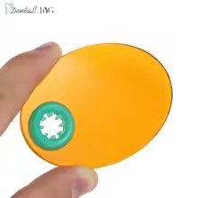 Orange dental light curing filter shield for blue light eye protection during composite and bonding agent photopolymerisation procedures.