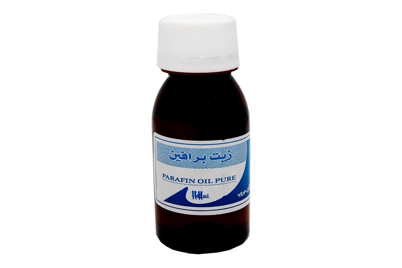 Pure paraffin oil bottle used for dental equipment lubrication.